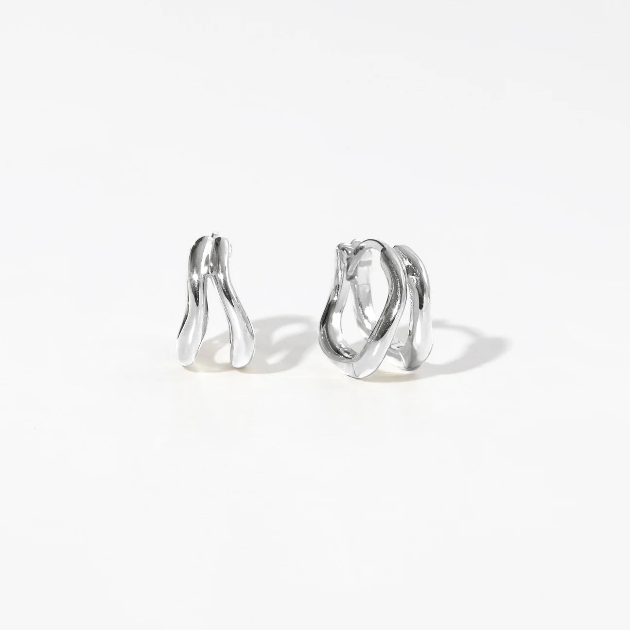 CORA • Wave silver huggies